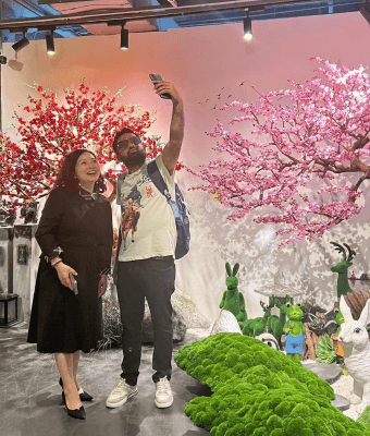 Artificial cherry blossom tree with visitors
